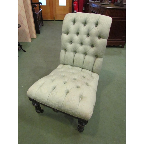 4022 - A 19th Century ebonised button-back nursing chair in pale green damask upholstery, slight marks to f... 