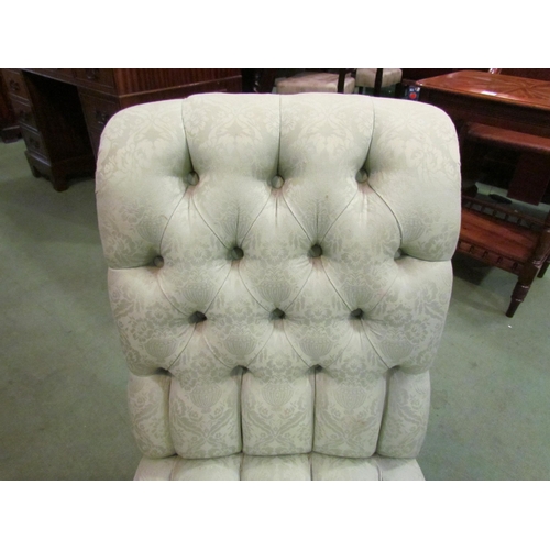 4022 - A 19th Century ebonised button-back nursing chair in pale green damask upholstery, slight marks to f... 