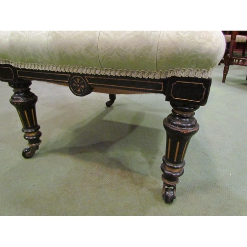 4022 - A 19th Century ebonised button-back nursing chair in pale green damask upholstery, slight marks to f... 