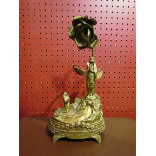 4047 - A French Lourdes gilt lamp base with religious theme, 27cm tall