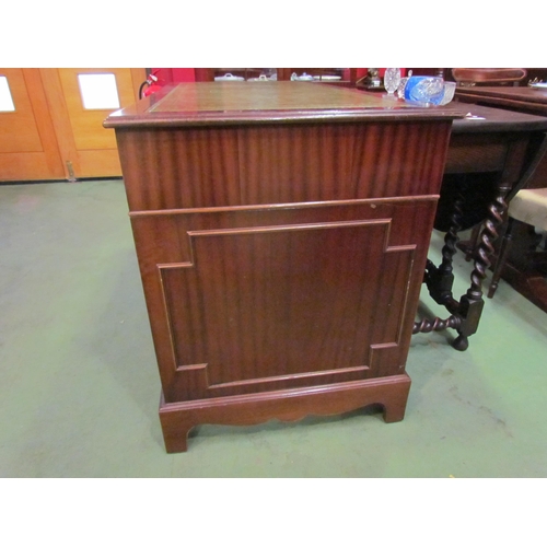 4074 - A reproduction mahogany eight drawer twin pedestal desk on bracket feet with gilt tooled leather top... 