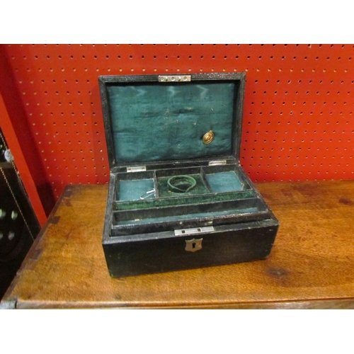 4079 - An early 20th Century leather bound jewellery box with fitted lift-out tray above twin compartments,... 