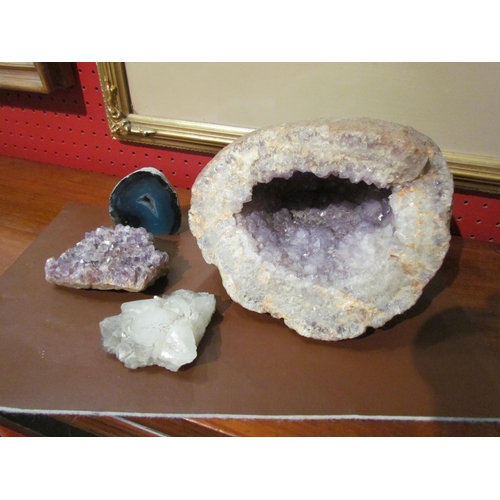 4087 - A large amethyst geode and three smaller specimen stones