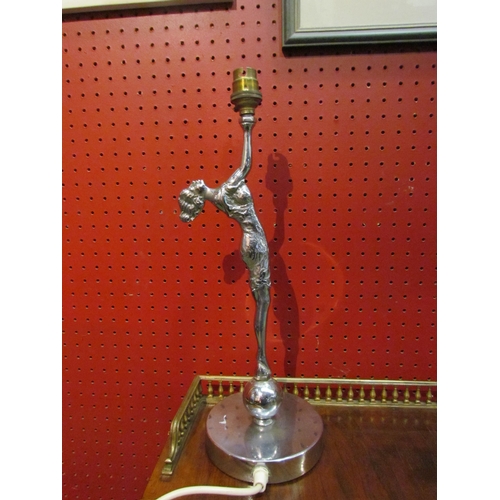 4103 - An Art Deco chrome table lamp base in the form of a lady standing on ball