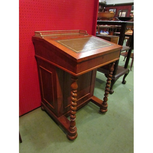 4104 - A mahogany Davenport with brass frieze gallery and gilt tooled leather lift-up top, fitted interior,... 