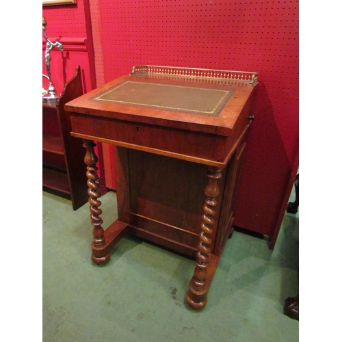 4104 - A mahogany Davenport with brass frieze gallery and gilt tooled leather lift-up top, fitted interior,... 