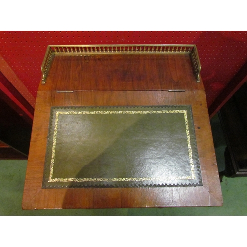 4104 - A mahogany Davenport with brass frieze gallery and gilt tooled leather lift-up top, fitted interior,... 