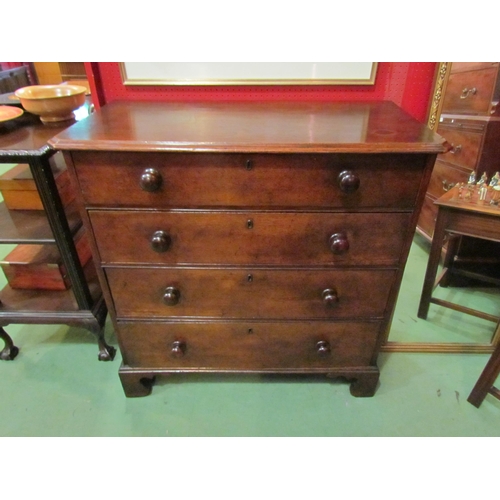 4120 - A 19th Century canted corner oak chest of four graduated long drawers with turned bun handles over b... 