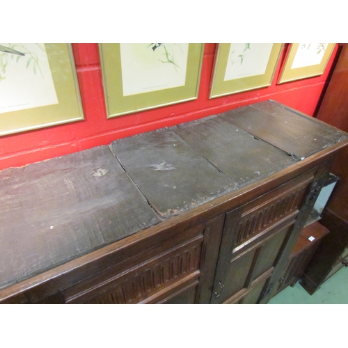 4131 - A 17th Century and later oak two door livery cupboard with carved panelled doors and ornate iron 