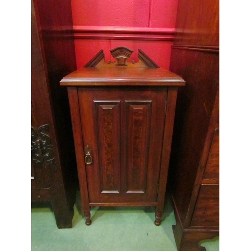 4133 - A late Victorian walnut bedside cabinet with raised arch back over a single door with turned brass h... 