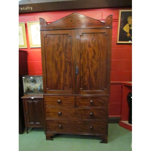 4134 - A Regency mahogany linen press with black line inlay, the two door and three tray interior with key ... 