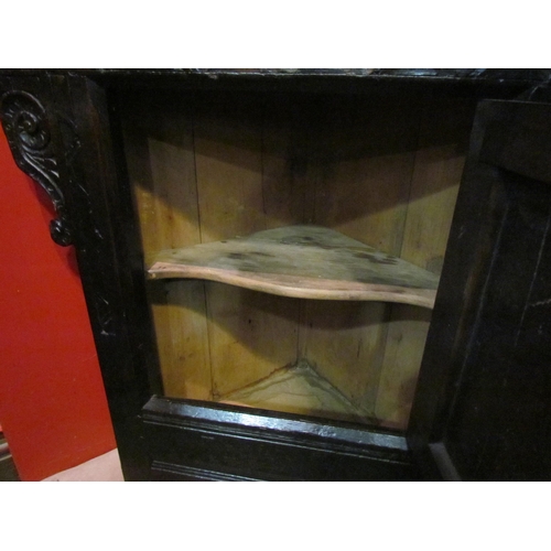 4138 - A 17th Century and later carved oak single door corner cupboard, 70cm tall x 56cm wide     (R) £100