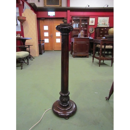 4139 - A stained mahogany and oak lamp base of column form, 83cm tall