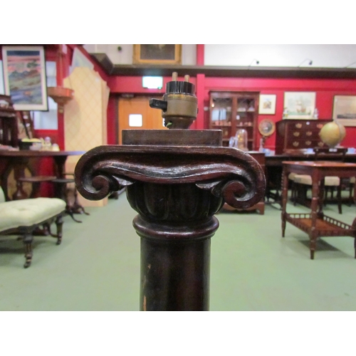 4139 - A stained mahogany and oak lamp base of column form, 83cm tall