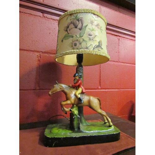 4142 - A vintage plaster table lamp, huntsman on horseback, plinth base, 1950's original shade