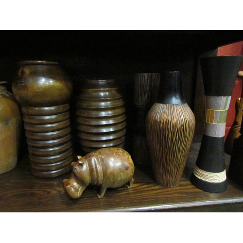 4144 - A collection of wooden vases, pots, hippo figure etc.