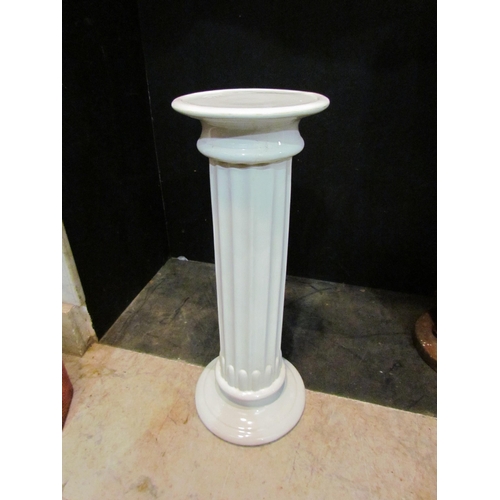 4156 - A ceramic column form pedestal jardinière stand, 55cm tall