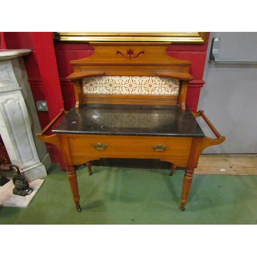 4159 - A late Victorian/early Edwardian marble topped wash stand with tiled back on turned legs to castors,... 