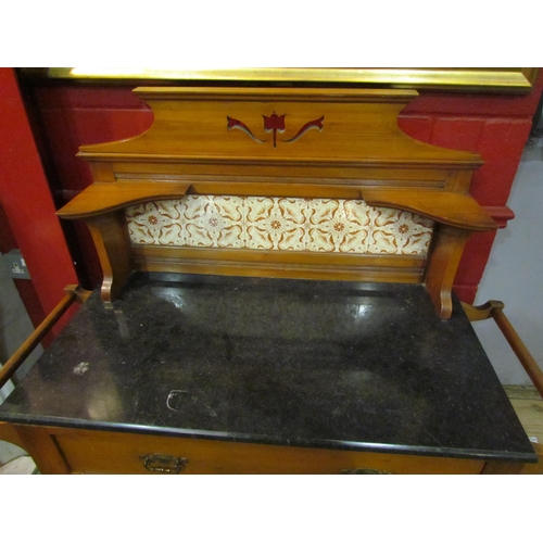 4159 - A late Victorian/early Edwardian marble topped wash stand with tiled back on turned legs to castors,... 