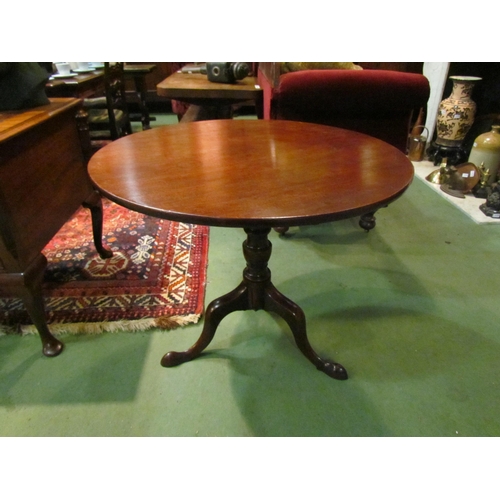 4161 - A George III mahogany circular tilt-top wine table on turned column and tripod base, 71cm tall x 84c... 