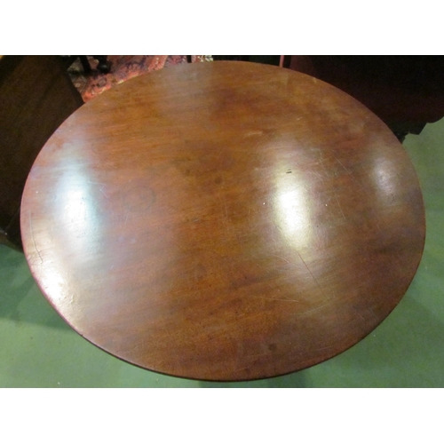 4161 - A George III mahogany circular tilt-top wine table on turned column and tripod base, 71cm tall x 84c... 