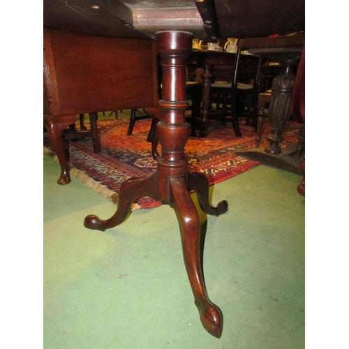 4161 - A George III mahogany circular tilt-top wine table on turned column and tripod base, 71cm tall x 84c... 