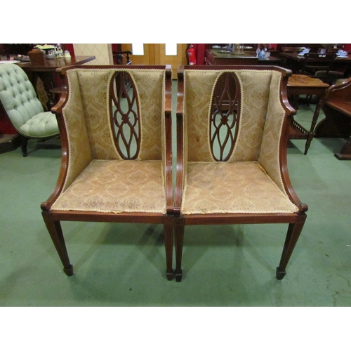 4176 - A pair of Edwardian mahogany framed wing-back armchairs, pierced oval back support, satinwood string... 