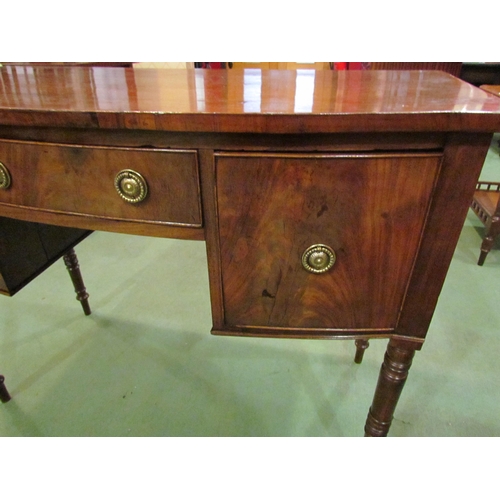 4178 - A George III flame mahogany bow-front sideboard of three drawers over turned and tapering leg suppor... 