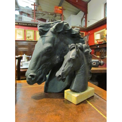 4182 - A plaster bust of horses head, 31cm tall, together with a smaller example on plinth base, 21cm tall