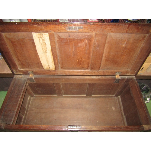 4003 - A late 17th/early 18th Century oak three panel coffer, candle box compartment interior, stile feet, ... 