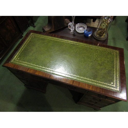 4074 - A reproduction mahogany eight drawer twin pedestal desk on bracket feet with gilt tooled leather top... 