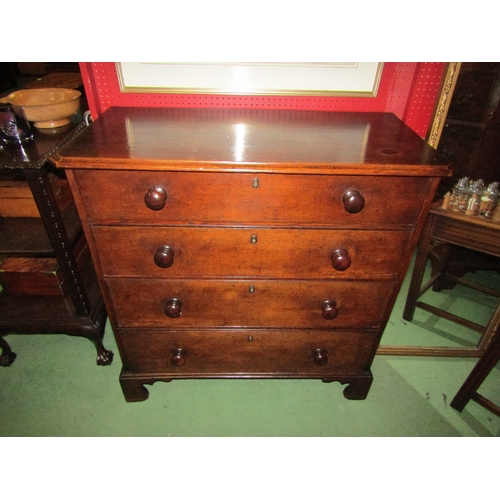 4120 - A 19th Century canted corner oak chest of four graduated long drawers with turned bun handles over b... 