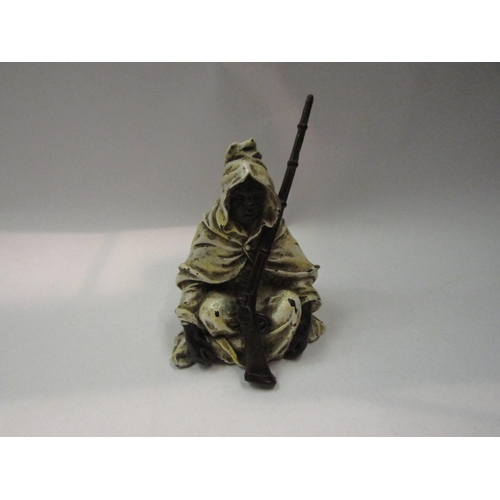 4321 - An Austrian cold-painted bronze Arab in cloak with rifle. 11cm tall        (R) £200