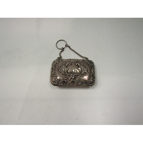 4353 - An early 20th Century silver purse, dated Birmingham 1905, foliate embossed case