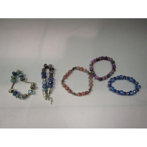 4355 - Two Pandora style charm bracelets and three others