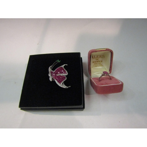 4357 - A stone set entremblant in the form of a butterfly stamped 925 together with a 925 and pink sapphire... 