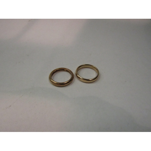 4373 - Two 9ct gold wedding bands. Sizes J and K, 5.7g