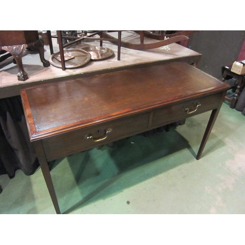 4199 - A Georgian mahogany writing table, the tooled edge writing surface over two frieze drawers on square... 