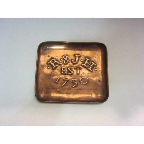 4223 - Two copper bar trays: Johnnie Walker and Teachers, together with an ashtray: R & J H Est 1750 (3)