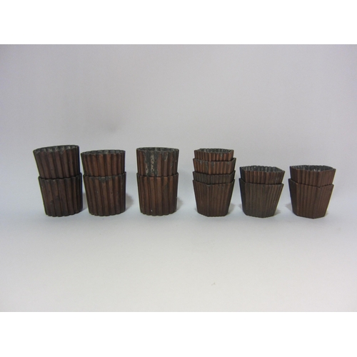 4224 - Nineteen copper tin canele molds