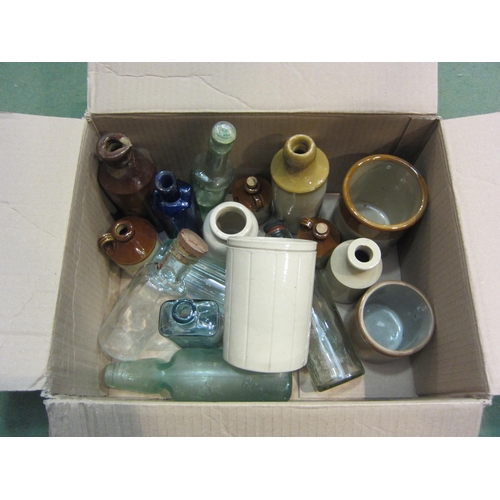 4241 - A quantity of glass and stoneware bottles and jars including apothecary examples