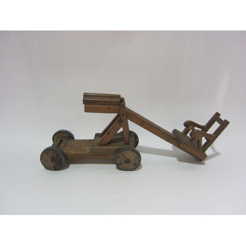 4292 - Three wooden toys; catapult, car, etc    (E) £10-20