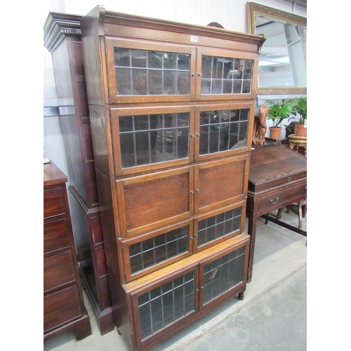 2257 - An Edwardian oak and lead glazed bureau stacking bookcase