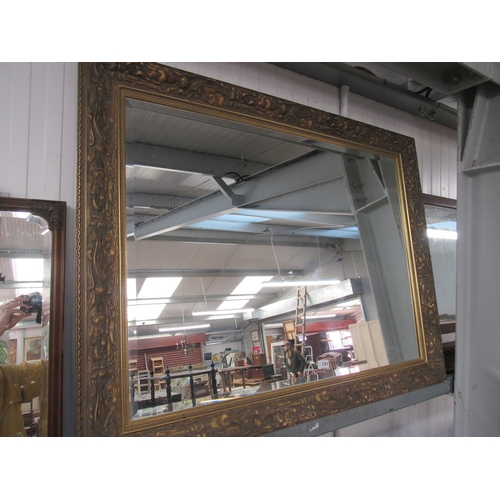 2262 - An ornate floral gilt overmantel mirror         (R)     £40