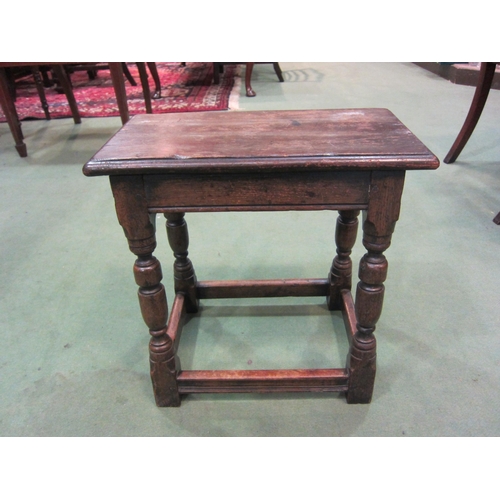 4009 - A Jacobean style oak stool on stretcher base, 45cm tall x 38cm wide x 29cm deep