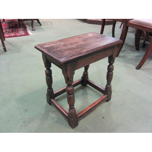 4009 - A Jacobean style oak stool on stretcher base, 45cm tall x 38cm wide x 29cm deep