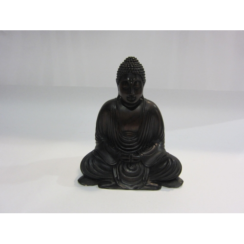 4014 - A carved wooden figure of seated Buddha, 20cm tall