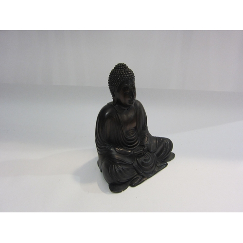 4014 - A carved wooden figure of seated Buddha, 20cm tall