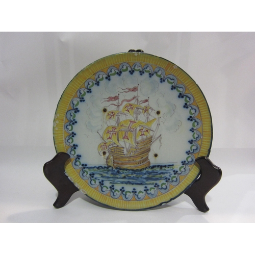 4053 - A Portuguese polychrome wall charger decorated with galleon, four drilled holes with rusted screws, ... 