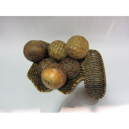 4189 - An Indonesian banana wood bowl and dish together with carved balls